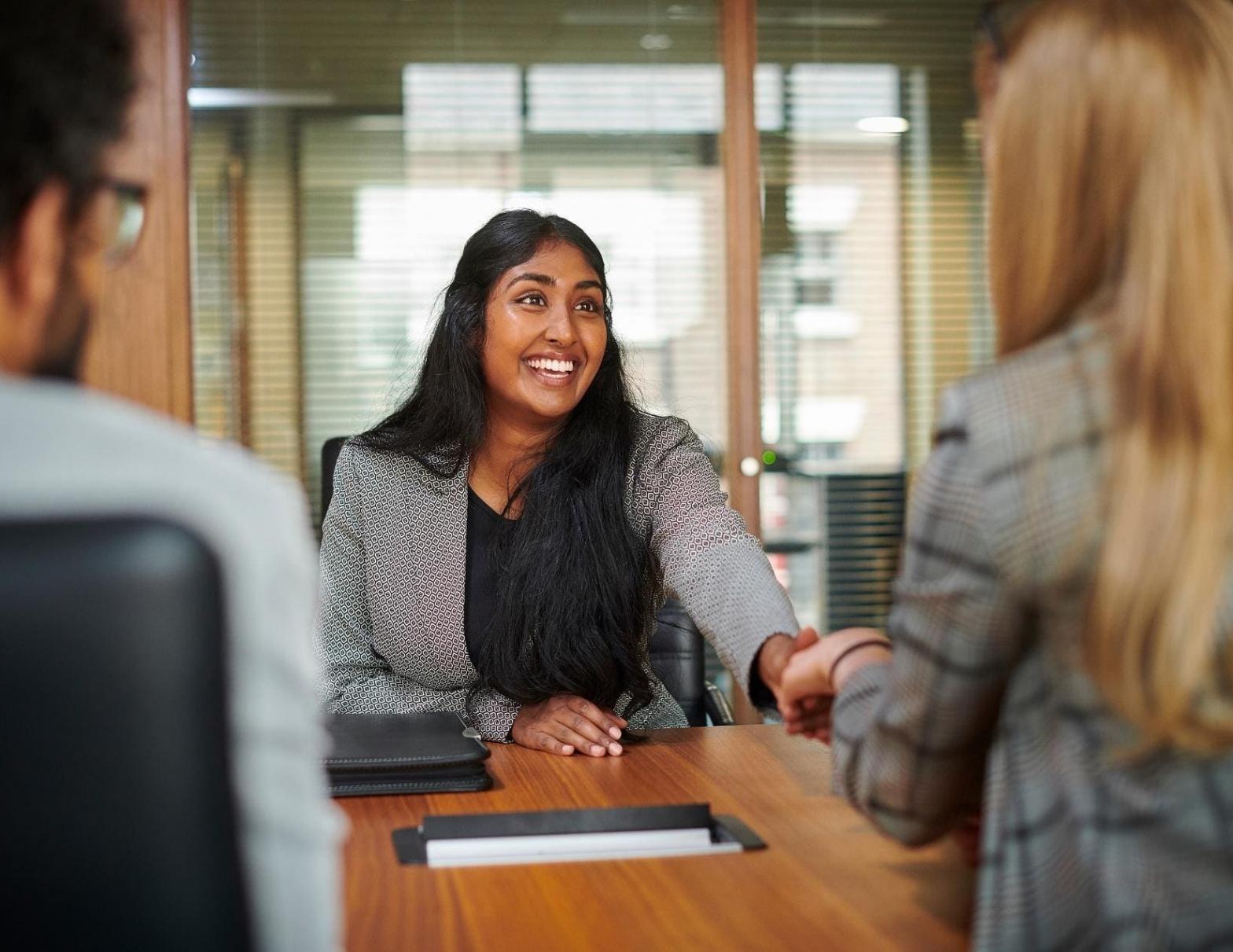Journalist taking detailed notes during interview session